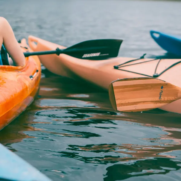 a woman sitting on a boat in the water