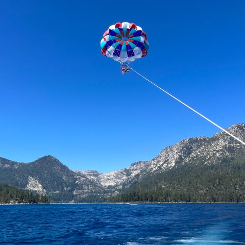 a man flying through the air over a body of water